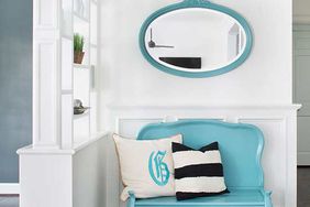 blue love seat with blue oval mirror