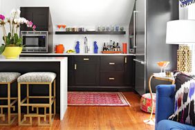 kitchenette with black cabinets