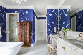 victorian style bathroom with blue wallpaper
