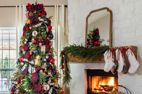 Christmas tree and fireplace with stockings and tartan garland