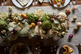 fall produce centerpiece at a harvest table