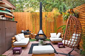 backyard with wooden fence patio tile