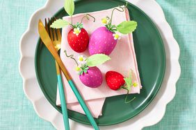 Spring place setting with strawberry craft on napkin and plate
