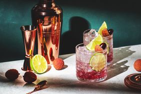 Mocktails in glasses with fruit and cocktail shaker
