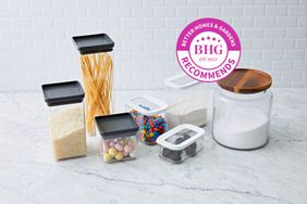 Assortment of pantry storage containers we recommend displayed on a marble surface against a white tiled background