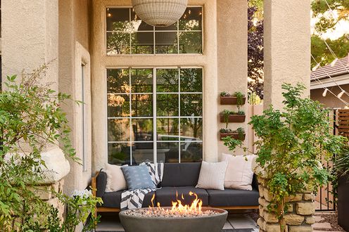 patio with string lights and fire pit
