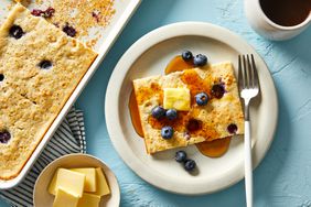 oven baked pancakes topped with butter, syrup and blueberries