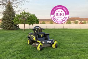 The Ryobi Battery Electric Cordless Zero Turn Riding Mower displayed in a large lawn