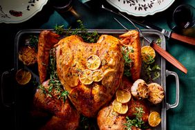 spatchcock Mediterranean turkey on tray with lemons