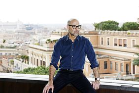 Stanley Tucci with Rome skyline in background