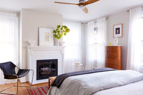 white brick fireplace in bedroom