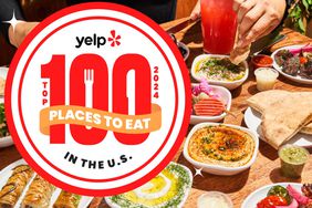 Yelp top 100 places to eat logo on photo of table with food at restaurant