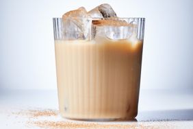 pumpkin spice white russian in cocktail glass with ice