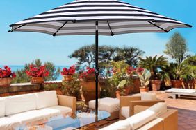 Blissun 9' Outdoor Aluminum Patio Umbrella displayed on a patio between two sofas