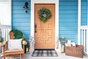 residential front door decorated with a Christmas wreath