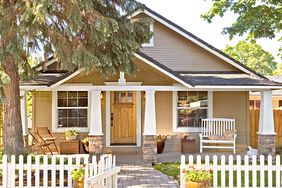 craftsman-style home with fenced-in front yard