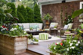 deck with seating and greenery