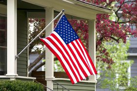 An American flag on a front porch