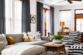 eclectic living room with striped black and white chairs