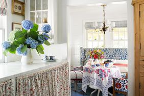 cottage farmhouse dining and breakfast nook with blue floors