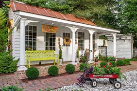 formal garden cottage with porch and colonnade