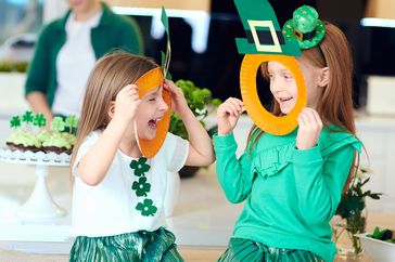 girls laughing with st patrick's day decor