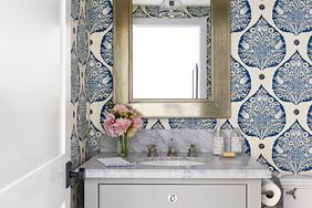 blue patterned teardrop-shaped wallpaper in bath
