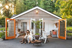 hayley and dog sitting outside renovated tiny home