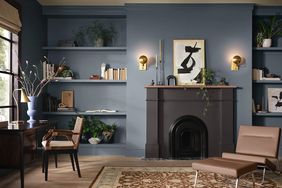 living room with black fireplace and blue walls