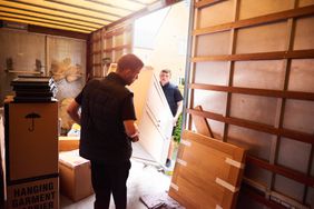 moving company moving furniture into truck