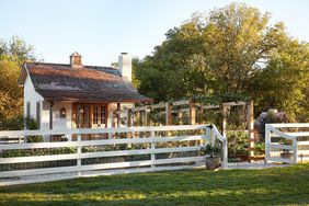 Joanna Gaines' garden house, arbors with vines, white fence