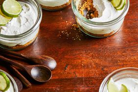 Key Lime Mason Jar Cheesecakes in mini jars with lime slices