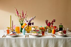 Florals and candles at a colorful table setting