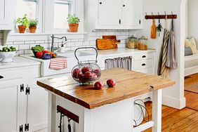 Kitchen with white décor and island