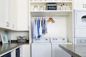 Laundry room with bin and clothes storage