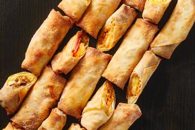 overhead view of Egg Rolls on black surface
