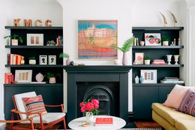 painted fireplace and built in bookcases in living room