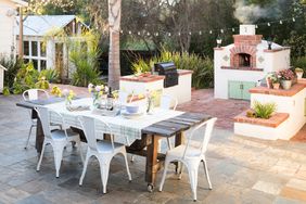 patio eating area with grill and pizza oven