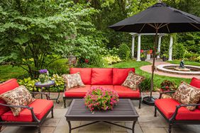 red patio furniture back yard garden landscape