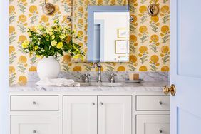 Powder room with yellow and orange wallpaper