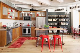 red stools and rug with open storage racks kitchen