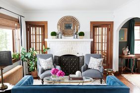 sitting area with white brick fireplace