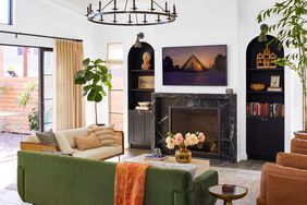 sitting room with statement light fixture and eclectic couches