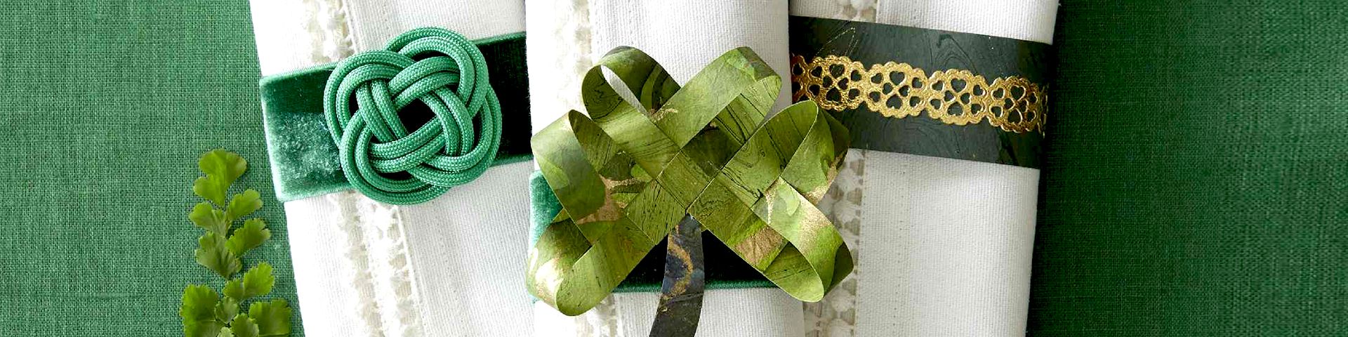 St. Patrick's Day festive napkin holders on a green tablecloth