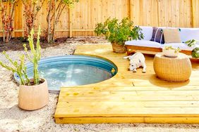 stock tank pool with a wooden deck