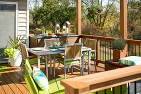 sunny deck with light wood and green accents