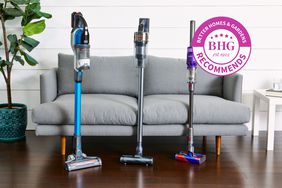 Three different Cordless Vacuums for Pet Hair leaning against a couch