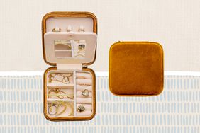 One of the best gifts for best friends, a travel jewelry box, on a patterned background.
