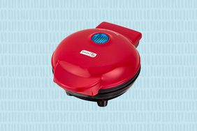 Dash Mini Waffle maker on a blue patterned background