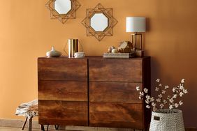 Wall behind wood console with accessories painted in Autumn Spice